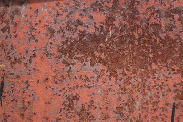 scratched and rusty orange metal surface