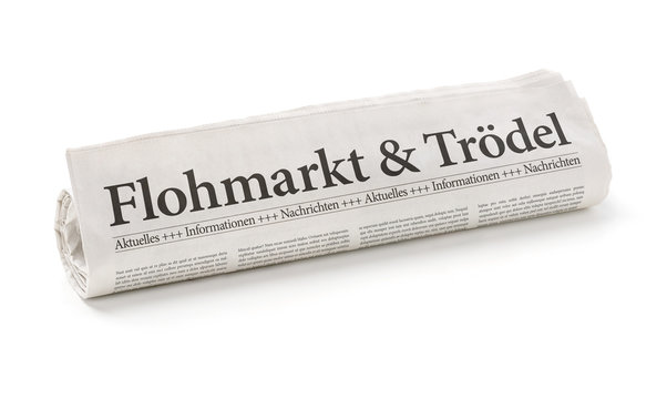 Zeitungsrolle mit der Überschrift Flohmarkt und Trödel
