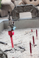 Obraz na płótnie Canvas joss stick pot sculpture in the temple