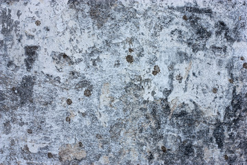 Textured walls with dirt.