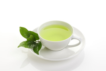 Obraz na płótnie Canvas Japanese green tea and fresh green tea leaves