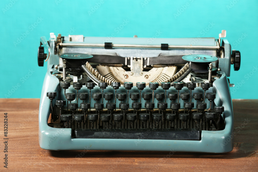 Poster old retro typewriter on table on green background