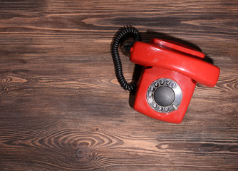 Retro red telephone on table close-up