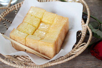 Bread, butter, topped milk with tasty.