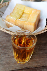 Bread, butter, topped milk with tasty and tea