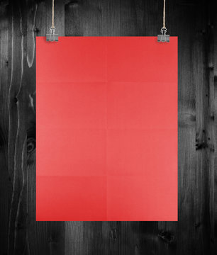 Red Poster On A Wood Wall.