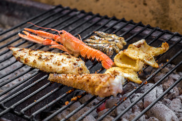 grilled fish on charcoals