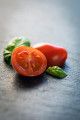 Cherry tomatoes and basil leaves