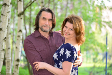 Fototapeta premium Adult men and women in summer park