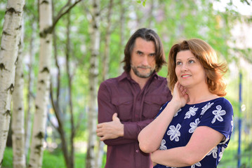 Fototapeta premium Adult men and women in summer park