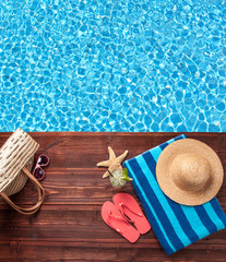 Naklejka premium Swimming accessories on wooden mole