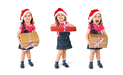 Blonde christmas kid with a gift