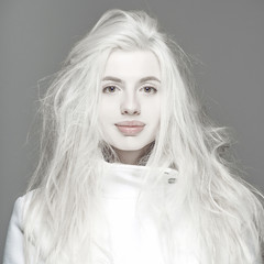 Fototapeta premium Blonde fashion woman sexy natural lips posed on blue background 