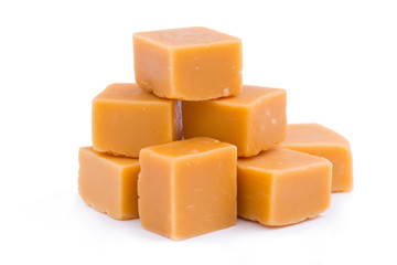 Tasty toffees on a white background.