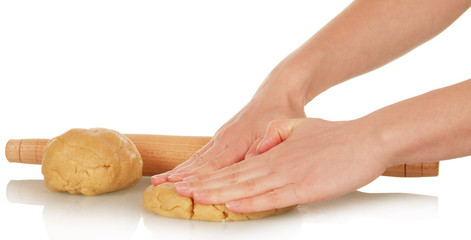 Obraz na płótnie Canvas Female hands rolling dough