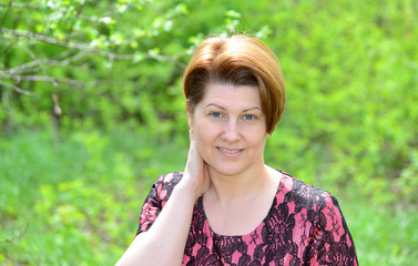 Portrait of a middle-aged woman on  nature