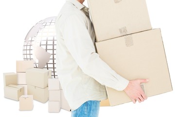 Composite image of delivery man carrying cardboard boxes