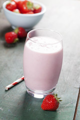 A glass of strawberry smoothie