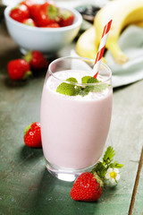 A glass of strawberry smoothie