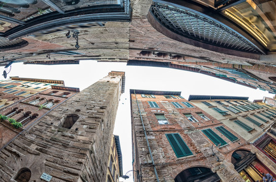 Ancient medieval city buildings of Lucca, Tuscany. Fisheye view
