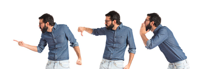 Young hipster man doing bad signal