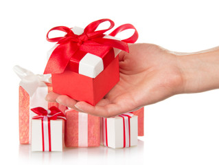 Present boxes and female hand with gift