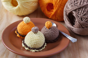 Fototapeta na wymiar Handmade colorful crochet toys sweets