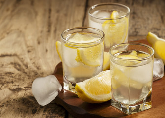 Refreshing cocktail with lemon and ice, selective focus