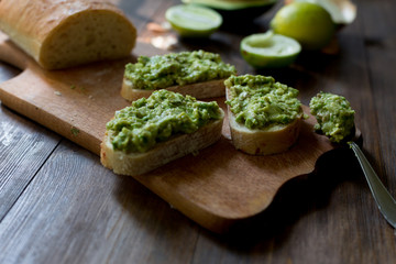 preparation guacamole ingridients on table lime, onion, avocado