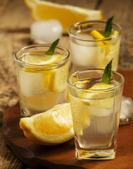 Refreshing cocktail with lemon and ice, selective focus