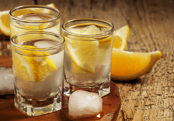 Refreshing cocktail with lemon and ice, selective focus