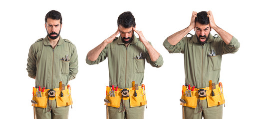 frustrated mechanic over white background