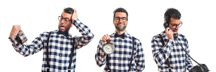 Surprised posh boy holding vintage clock