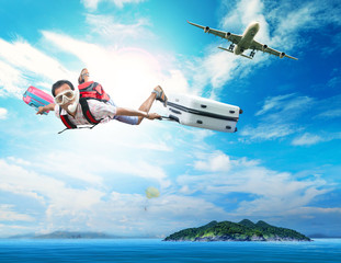 young man flying on blue sky wearing snorkeling mask and holding