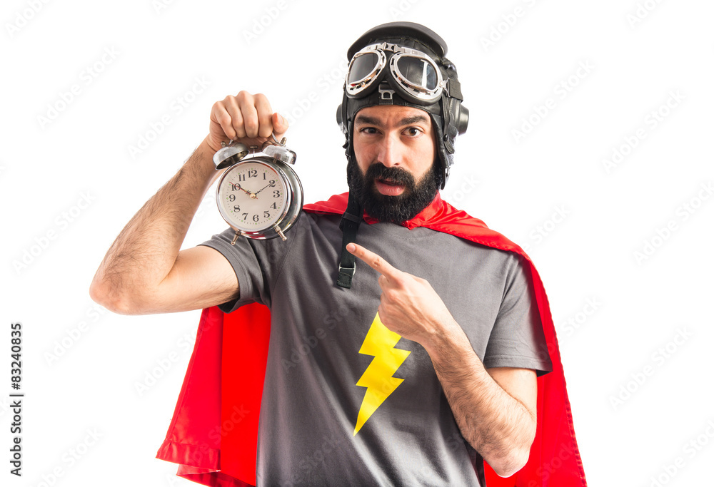 Wall mural Super hero holding vintage clock