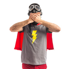 Superhero covering his face