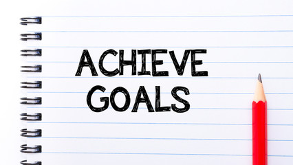 Achieve goals Text written on notebook page