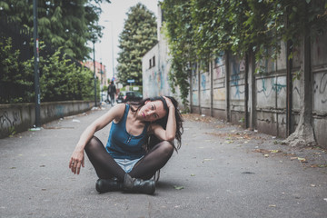 Beautiful girl posing in the city streets