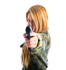 Military woman aiming a gun