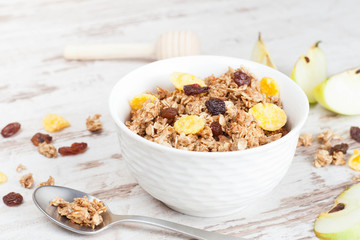 homemade granola in a bowl and spoon