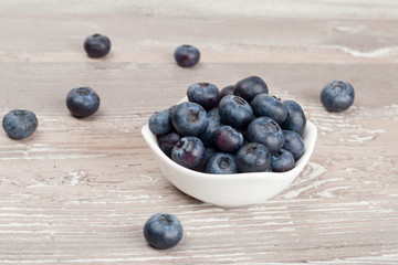 white bowl of fresh blueberries closeup