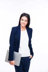 Happy businesswoman standing with laptop