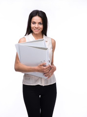 Happy businesswoman standing and holding folders