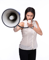 Angry businesswoman standing with megaphone