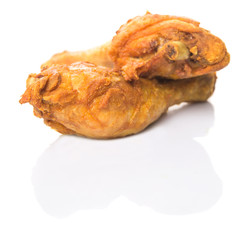 Deep fried chicken drumsticks over white background
