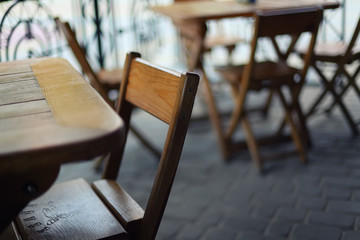 tables and chairs in the bar at shallow depth of field