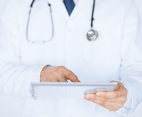 male doctor holding tablet pc