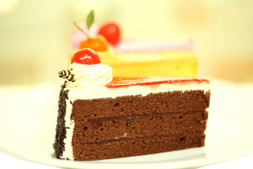 Beautiful tasty chocolate cake close up isolated on white backgr