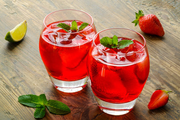 Cold strawberries drinks with strawberry slices and mint