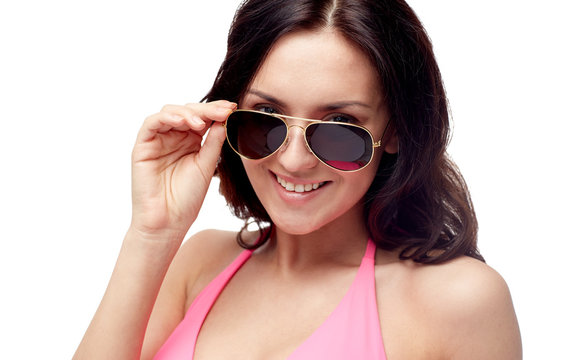 happy woman in sunglasses and swimsuit